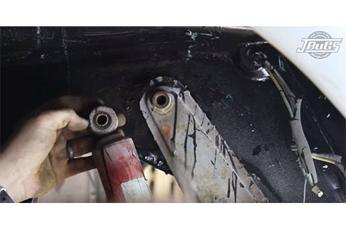 Unbolt and remove the right shock absorber 