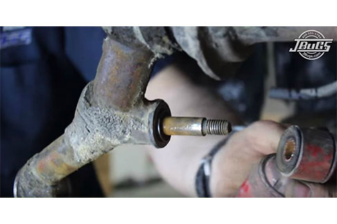 Unbolt and remove the right shock absorber